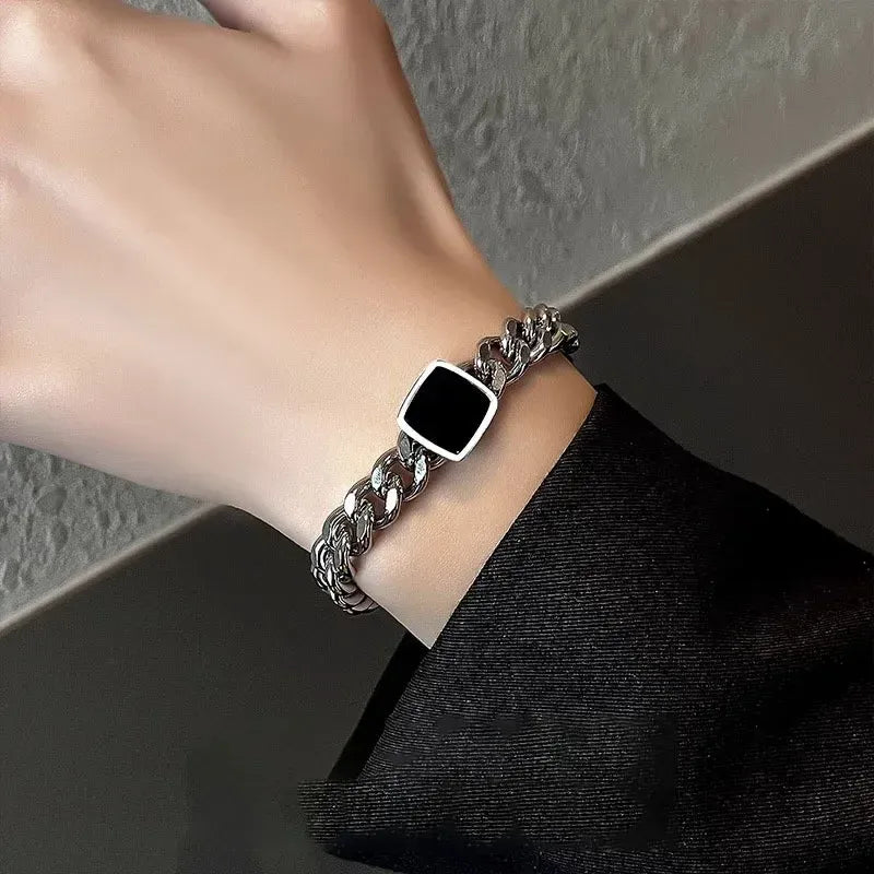 Male model's wrist wearing the Square Cuban Titanium Steel Bracelet (His) showing modern fit.