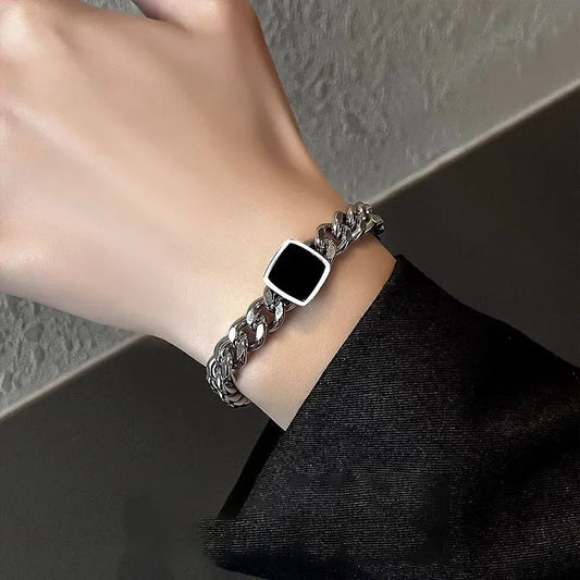 Male model's wrist wearing the Square Cuban Titanium Steel Bracelet (His) showing modern fit.